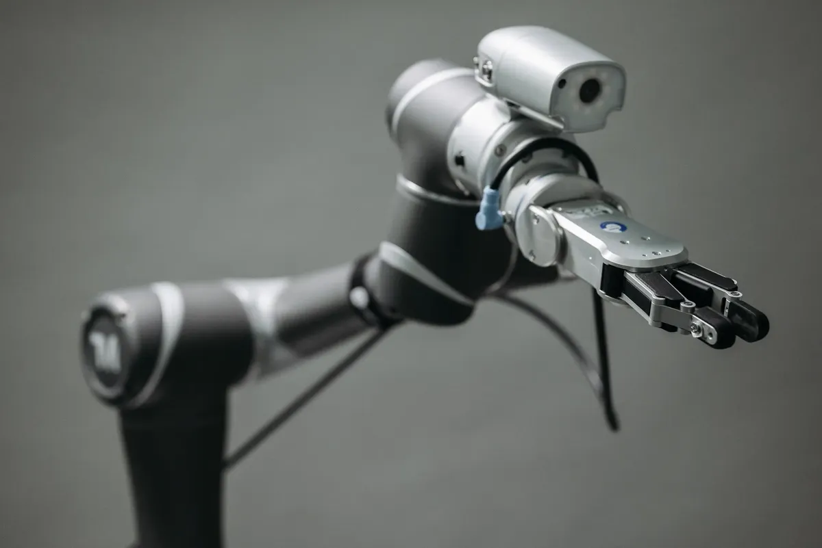 Close-up view of a robotic arm equipped with a video camera, showcasing modern technology.