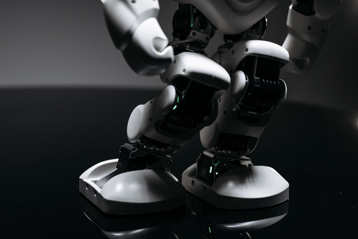 high-resolution close-up of a robotic joint with lubricant and inspection tool