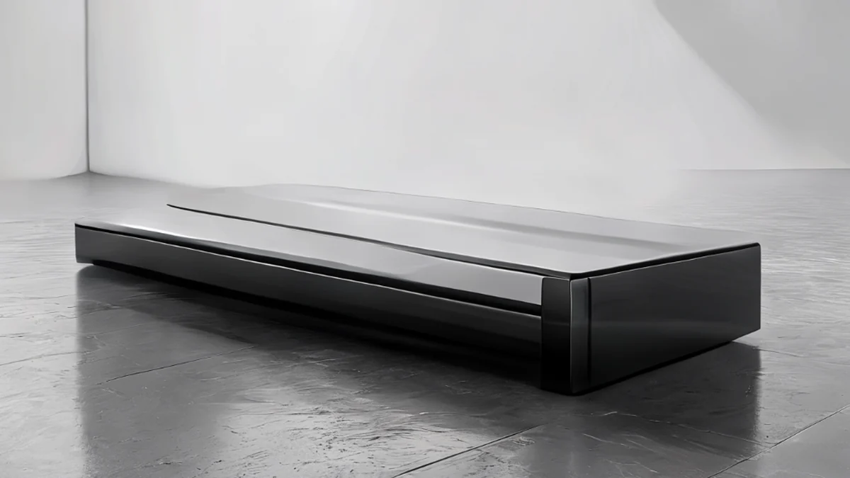Een dock met ergonomisch ontwerp, glanzend zwart finish, rechthoekige vorm, op een grijs tafel onder een schoon studio-softbox, lage diepte van veld, fotorealistisch, scherp focus, hoge details
